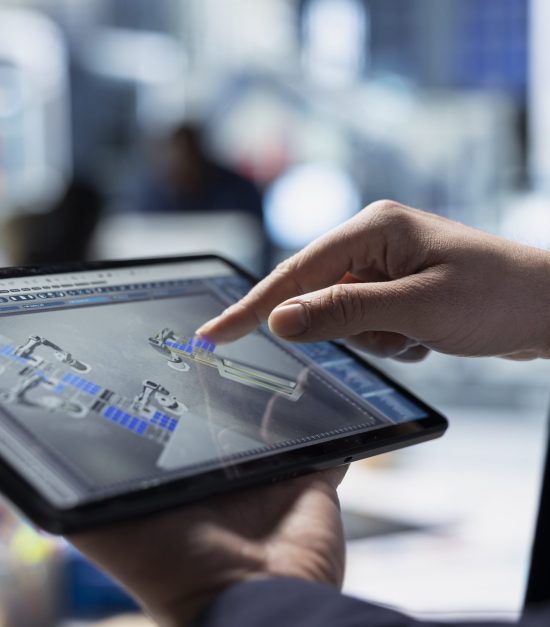 Solar factory expert monitors machinery performance on a production line, ensuring operational efficiency and supporting sustainable energy goals through professional diligence. Close up.